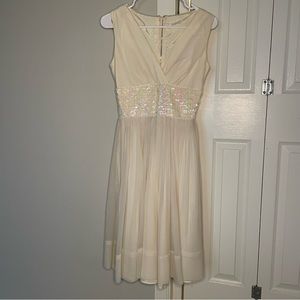 Vintage 50s 60s Sa’ Bett cream sleeveless dress with sequin waistband  XS?